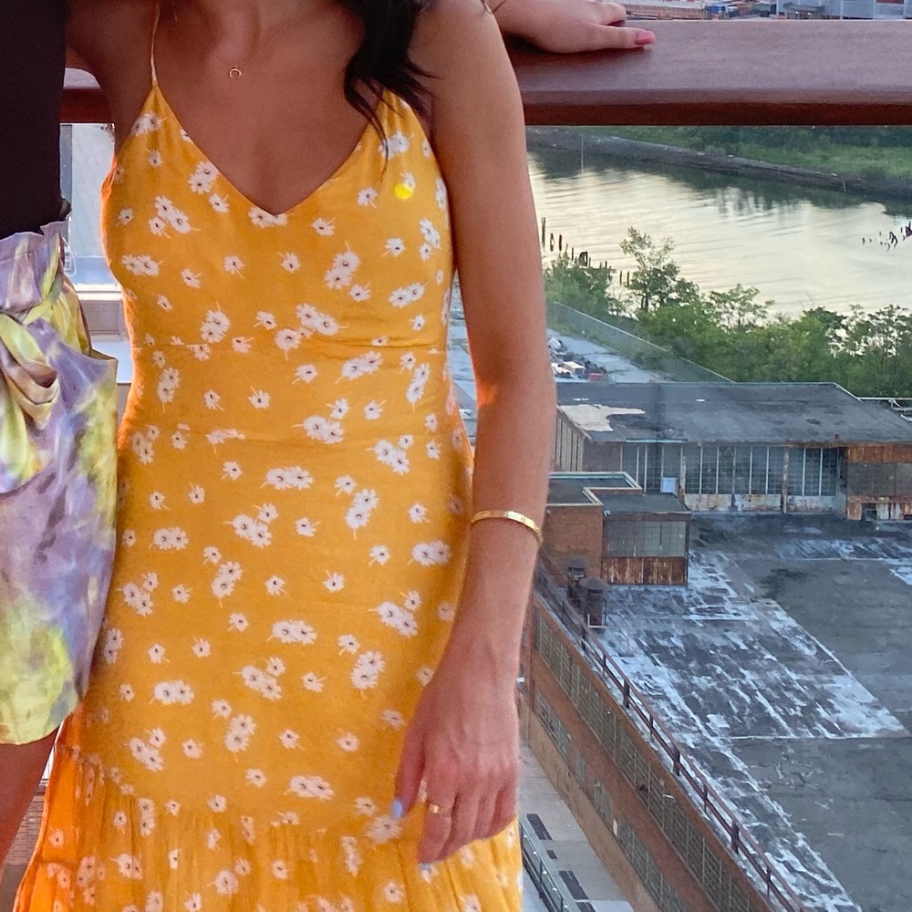 Yellow floral sundress with white flower design